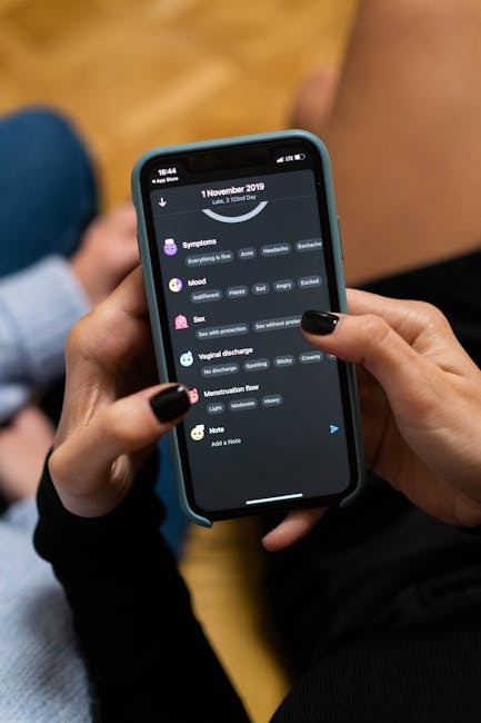Close-up of woman using a smartphone health tracking app, focusing on personal wellness data.